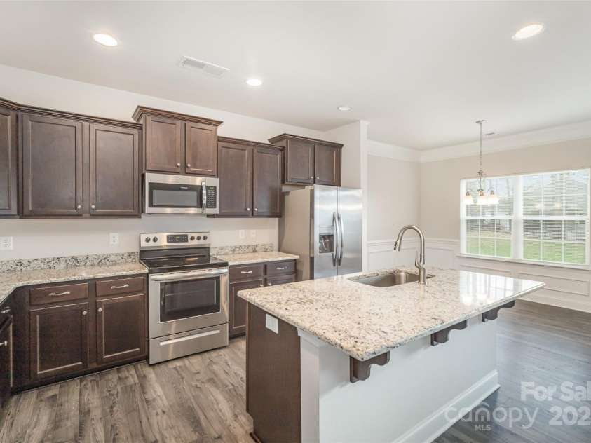 159 Rubys Way, Oakboro, NC 28129.  MLS# CAR4287834, YatesRealty ID 279. Another Photo of the Kitchen and Eat-In Dining Areas.