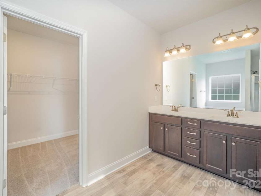 159 Rubys Way, Oakboro, NC 28129.  MLS# CAR4287834, YatesRealty ID 279. Primary Bathroom showing entryway into the massive walk-in closet.