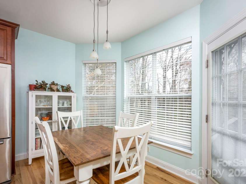 3329 Brownes Creek Road, Charlotte, NC 28269.  MLS# CAR4232626, YatesRealty ID 2790. Breakfast room with tons of natural light and a door that access the back 2 tier deck and patio