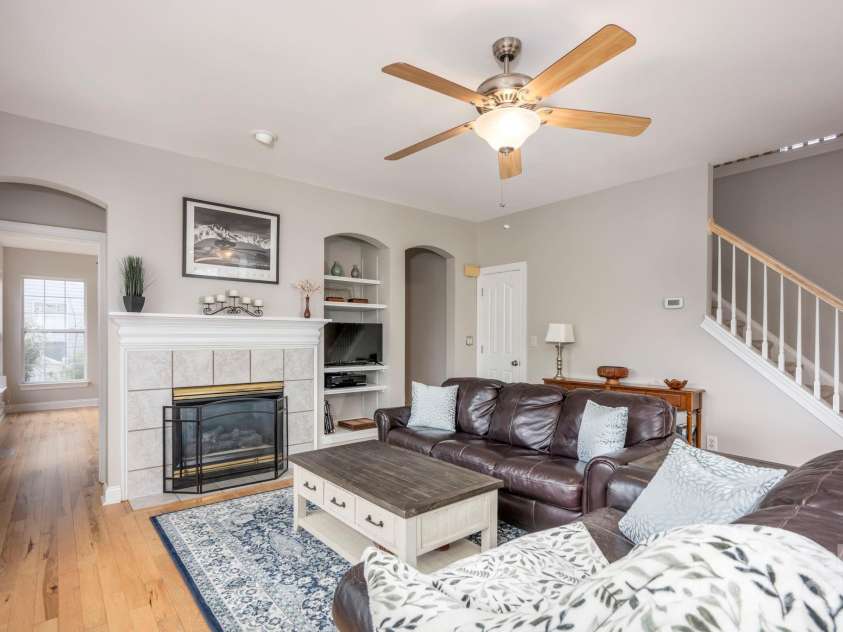 3329 Brownes Creek Road, Charlotte, NC 28269.  MLS# CAR4232626, YatesRealty ID 2790. Great room with hardwood floors, gas fireplace, ceiling fan and built ins