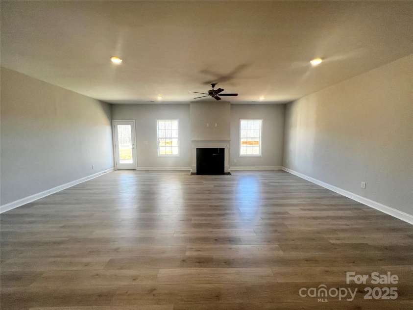 140 Swan Park Lane, Statesville, NC 28625.  MLS# CAR4284511, YatesRealty ID 27912. Great room with fireplace