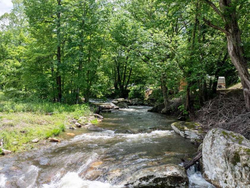 3206 Fork Mountain Road, Bakersville, NC 28705.  MLS# CAR4386731, YatesRealty ID 27916. Life on the river!