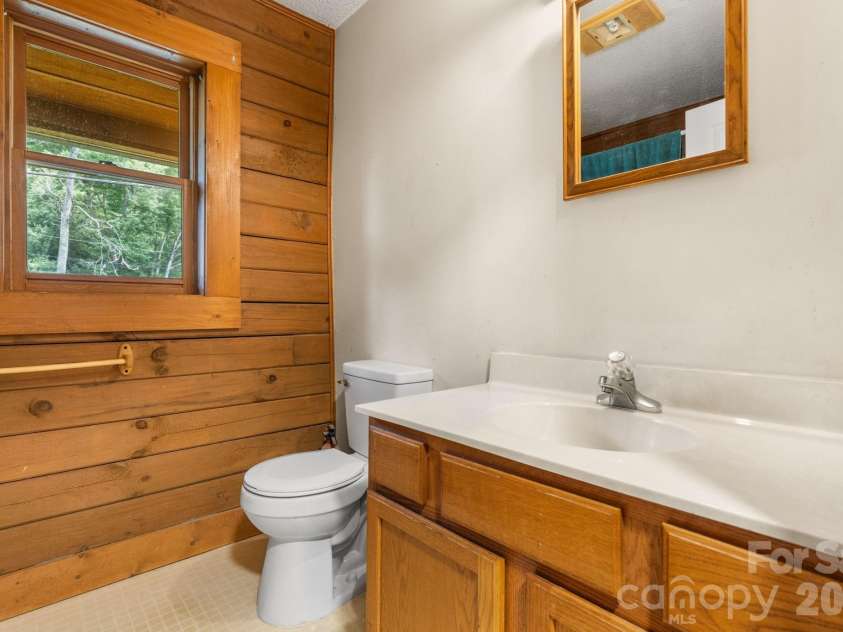3206 Fork Mountain Road, Bakersville, NC 28705.  MLS# CAR4386731, YatesRealty ID 27916. Lower level bathroom