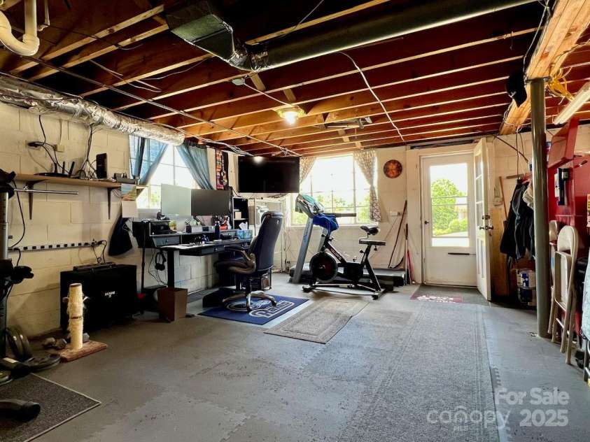 795 Monte Vista Road, Candler, NC 28715.  MLS# CAR4273590, YatesRealty ID 27916. Daylight walkout basement with big windows.