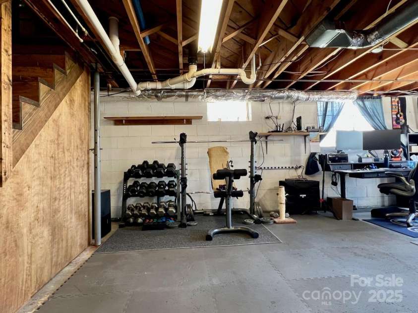 795 Monte Vista Road, Candler, NC 28715.  MLS# CAR4273590, YatesRealty ID 27916. Plenty of space for home gym or workshop