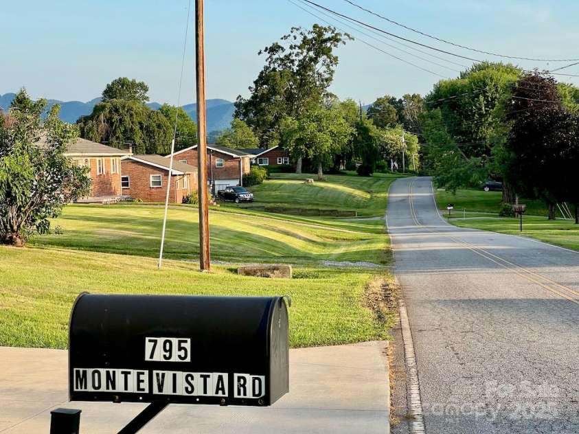 795 Monte Vista Road, Candler, NC 28715.  MLS# CAR4273590, YatesRealty ID 27916. Side street is great for walking