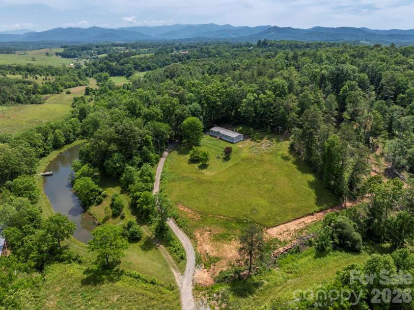 351 Mag Sluder Road, Alexander, NC 28701.  MLS# CAR4385877, YatesRealty ID 27928. Aerial w/Pond