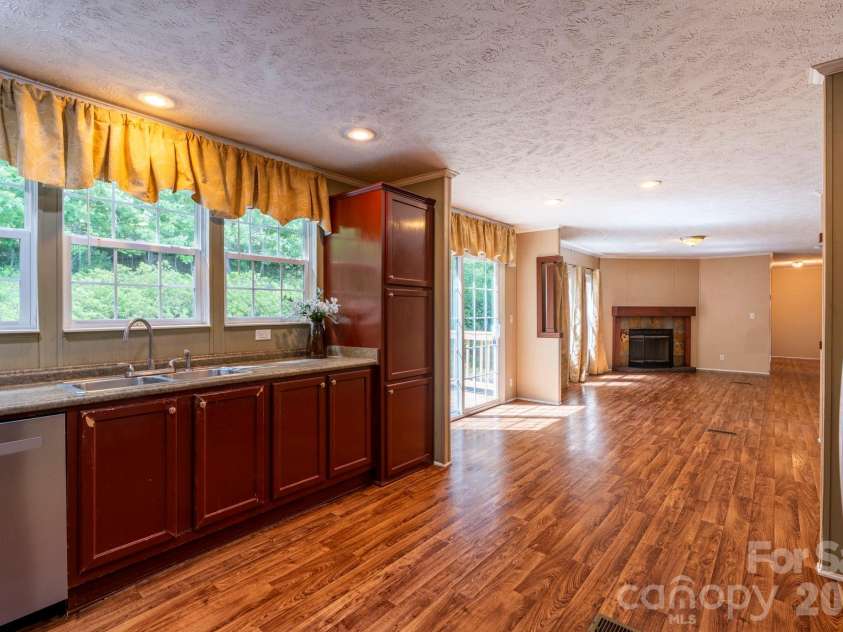 351 Mag Sluder Road, Alexander, NC 28701.  MLS# CAR4385877, YatesRealty ID 27928. Open Dining/Kitchen/Den