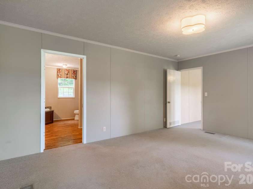 351 Mag Sluder Road, Alexander, NC 28701.  MLS# CAR4385877, YatesRealty ID 27928. Primary Bedroom