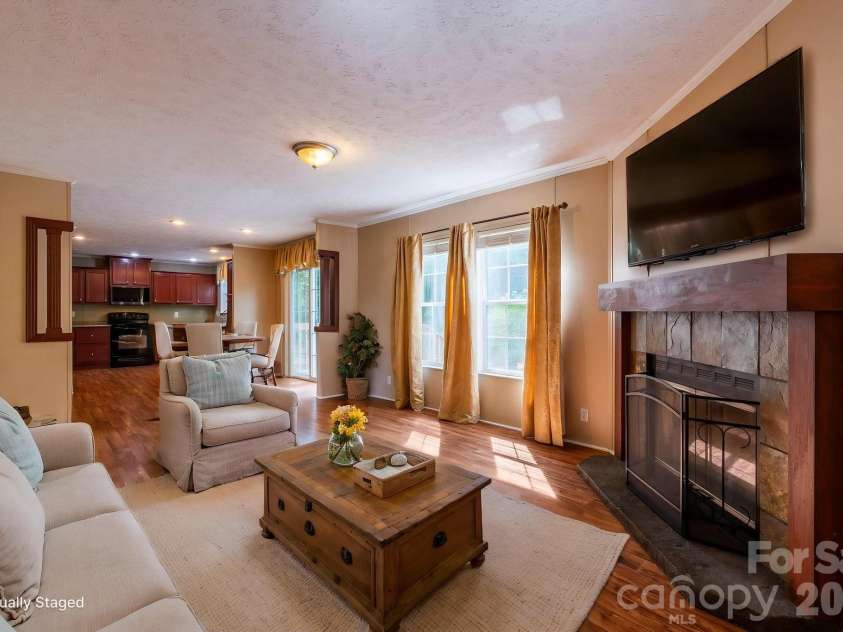 351 Mag Sluder Road, Alexander, NC 28701.  MLS# CAR4385877, YatesRealty ID 27928. Virtually Staged Den w/Wood Burning FP