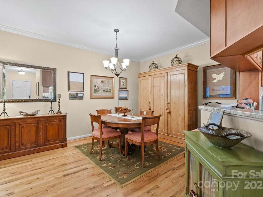 113 Fox Cross Drive, Brevard, NC 28712.  MLS# CAR4283870, YatesRealty ID 27930. Dining area - beautiful hardwood floors continue through living area