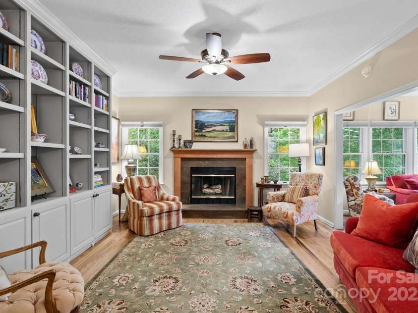 113 Fox Cross Drive, Brevard, NC 28712.  MLS# CAR4283870, YatesRealty ID 27930. Main living area with fireplace AND built-in bookshelves