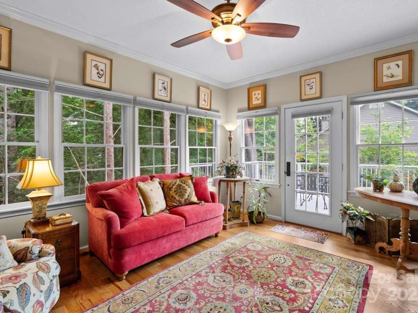 113 Fox Cross Drive, Brevard, NC 28712.  MLS# CAR4283870, YatesRealty ID 27930. Sunroom leads to back deck