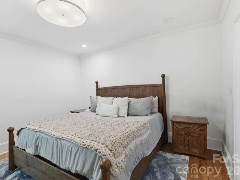 41 Chiles Avenue, Asheville, NC 28803.  MLS# CAR4374046, YatesRealty ID 27930. Primary bedroom offers beautiful en suite bath, closet and laundry