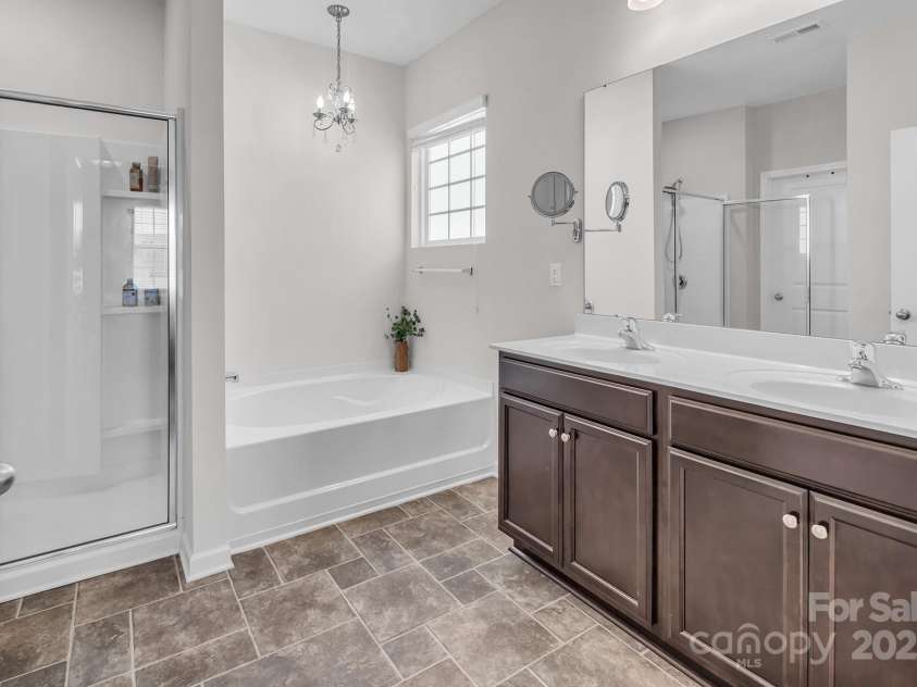 117 Rush Street, Mooresville, NC 28115.  MLS# CAR4280130, YatesRealty ID 27935. Spacious primary bathroom