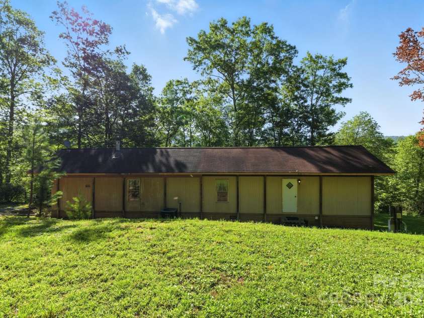 3333 Old Toxaway Road, Brevard, NC 28712.  MLS# CAR4282711, YatesRealty ID 27936. Back yard also has a level recreational spot with a outdoor grill.