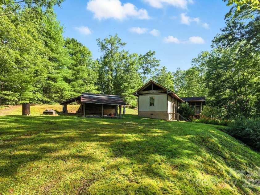 3333 Old Toxaway Road, Brevard, NC 28712.  MLS# CAR4282711, YatesRealty ID 27936. Several large flat areas around home. Great for parking your RV.