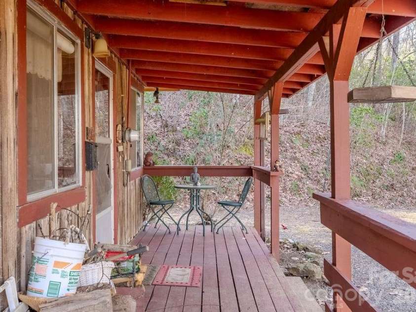 465 Enchanted Forest Drive, Sylva, NC 28779.  MLS# CAR4341154, YatesRealty ID 2794. Front porch