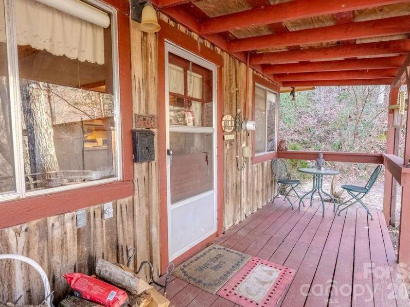 465 Enchanted Forest Drive, Sylva, NC 28779.  MLS# CAR4341154, YatesRealty ID 2794. Front porch