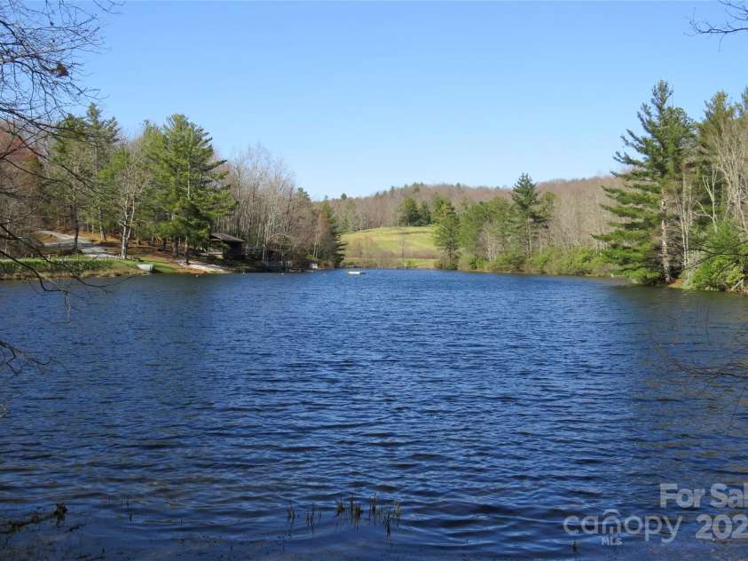 210 Ballard Road, Brevard, NC 28712.  MLS# CAR4300398, YatesRealty ID 2795. Community lake