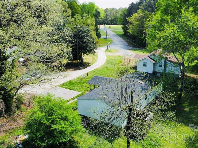 141 Lewis Street, Mount Gilead, NC 27306.  MLS# CAR4248799, YatesRealty ID 27952. Aerial from side and back