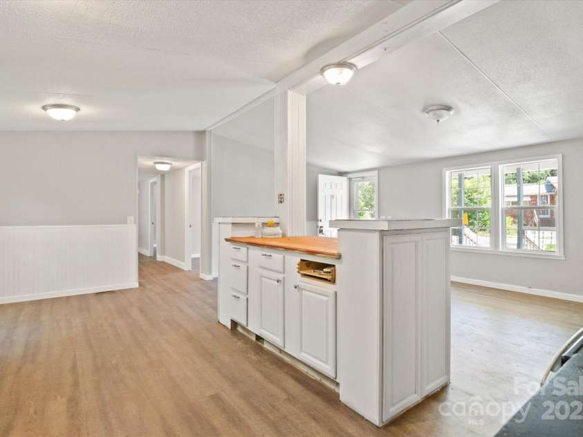 141 Lewis Street, Mount Gilead, NC 27306.  MLS# CAR4248799, YatesRealty ID 27952. Spacious kitchen with lots of storage and island