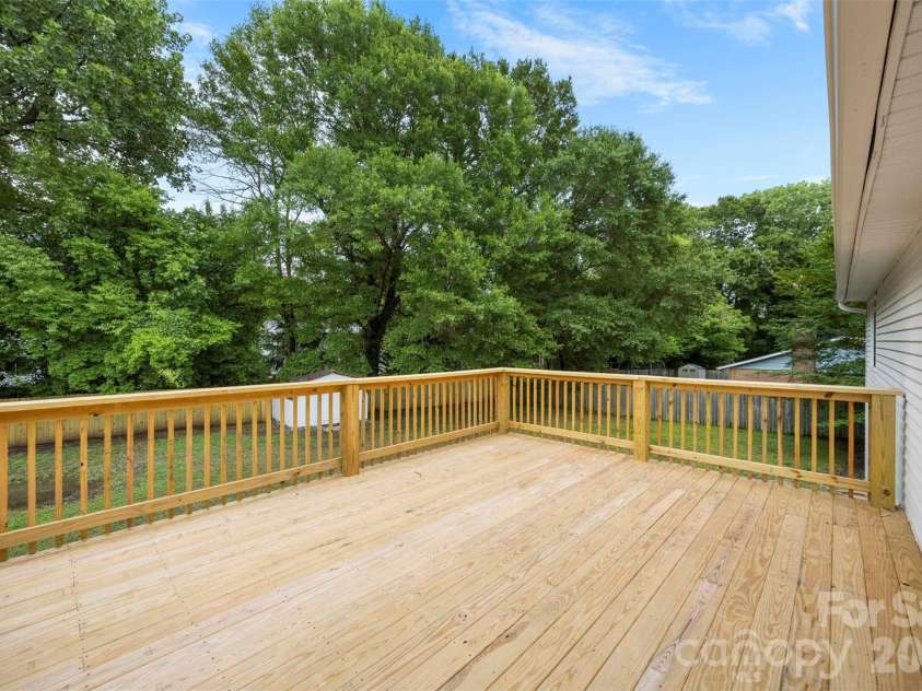 5903 Carpenter Drive, Charlotte, NC 28226.  MLS# CAR4388305, YatesRealty ID 27954. Large brand new back deck!
