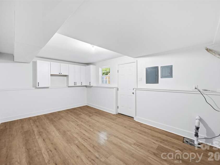 5903 Carpenter Drive, Charlotte, NC 28226.  MLS# CAR4388305, YatesRealty ID 27954. Large laundry + utility room and storage space. 