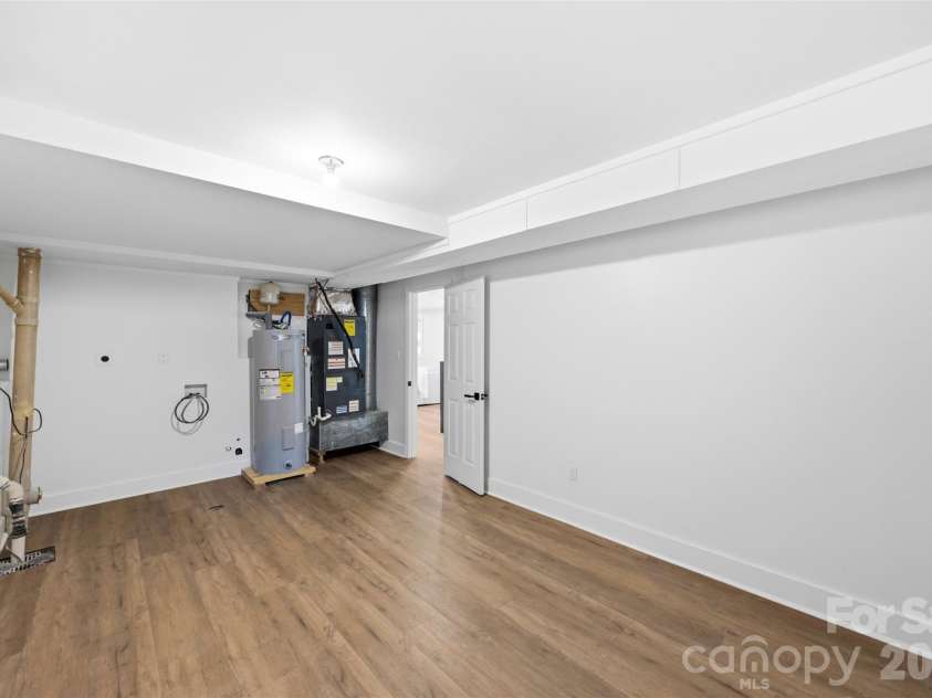 5903 Carpenter Drive, Charlotte, NC 28226.  MLS# CAR4388305, YatesRealty ID 27954. Large laundry + utility room and storage space. 