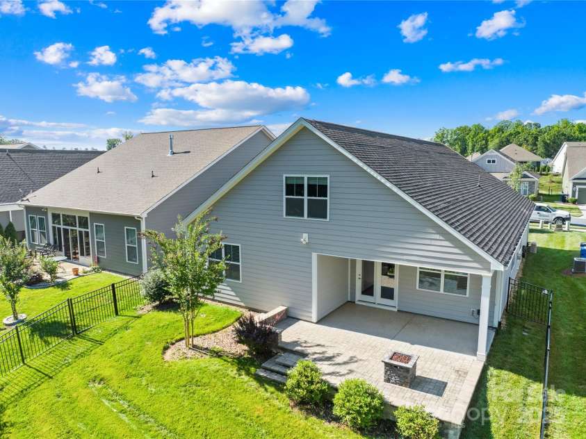 201 Hanks Bluff Drive, Mooresville, NC 28117.  MLS# CAR4273900, YatesRealty ID 27955. Beautiful backyard hardscaping with fireplace