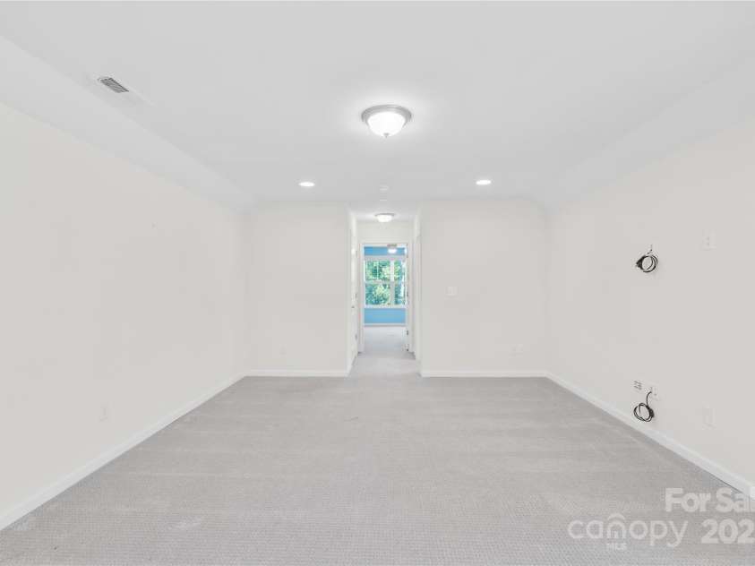 201 Hanks Bluff Drive, Mooresville, NC 28117.  MLS# CAR4273900, YatesRealty ID 27955. Large upstairs Bonus room/loft