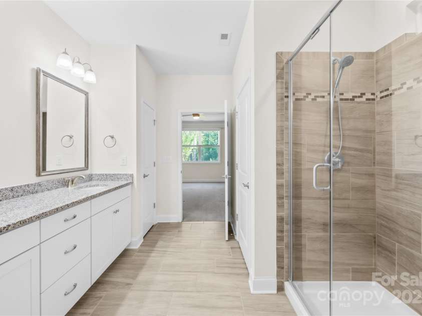 201 Hanks Bluff Drive, Mooresville, NC 28117.  MLS# CAR4273900, YatesRealty ID 27955. Large Walk-in Shower