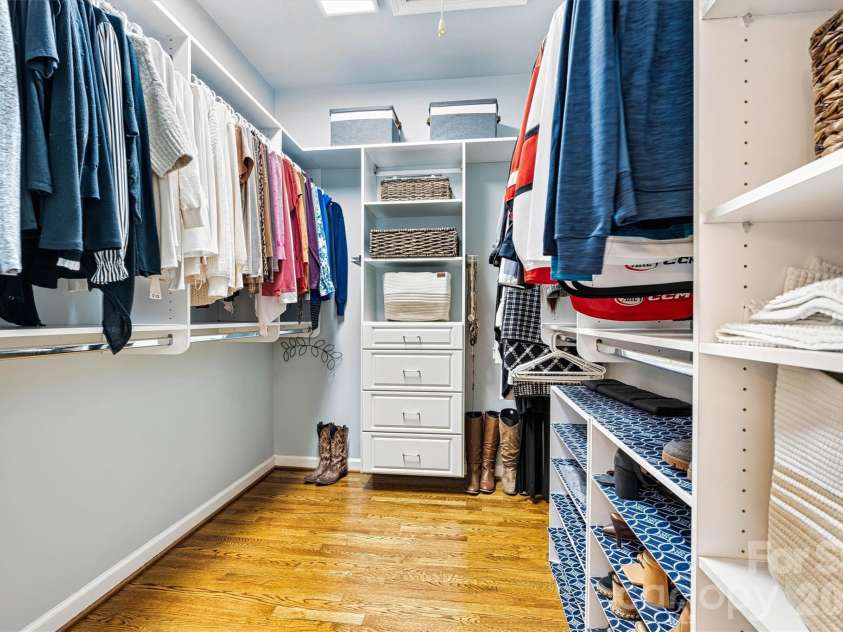 5028 Foxbriar Trail, Charlotte, NC 28269.  MLS# CAR4380862, YatesRealty ID 27956. Spacious Primary Closet with custom outfitting