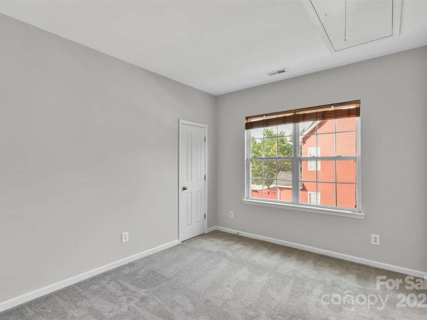 1821 Ethel Guest Lane, Charlotte, NC 28206.  MLS# CAR4276881, YatesRealty ID 27963. Huge window in the secondary bedroom letting in tons of light!
