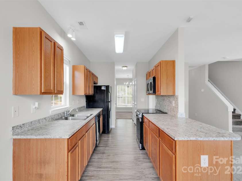 1821 Ethel Guest Lane, Charlotte, NC 28206.  MLS# CAR4276881, YatesRealty ID 27963. Tons of storage in this kitchen!