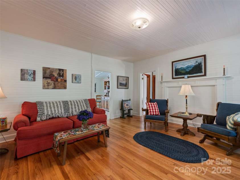 556 Crawford Cemetery Road, Sylva, NC 28779.  MLS# CAR4281056, YatesRealty ID 27964. Living Room with newly refinished hardwood floors