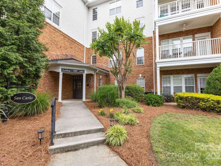 14857 Santa Lucia Drive, Charlotte, NC 28277.  MLS# CAR4258978, YatesRealty ID 27966. Front of condominium building