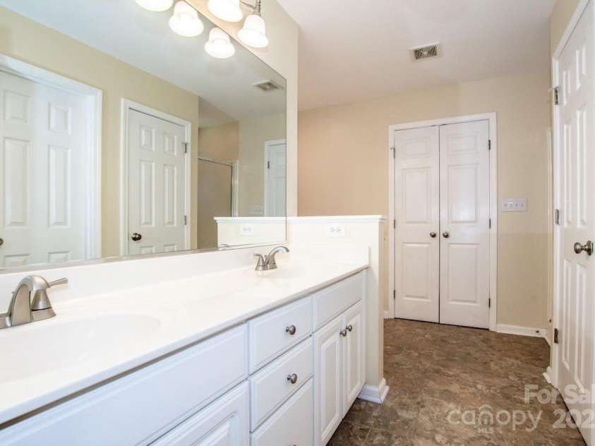 135 Woodstork Cove Drive, Mooresville, NC 28117.  MLS# CAR4282213, YatesRealty ID 27968. Primary bath with dual sinks.