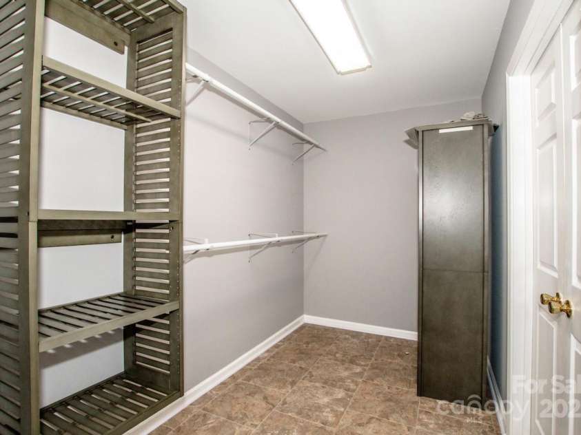 135 Woodstork Cove Drive, Mooresville, NC 28117.  MLS# CAR4282213, YatesRealty ID 27968. Walk in closet with extra storage.
