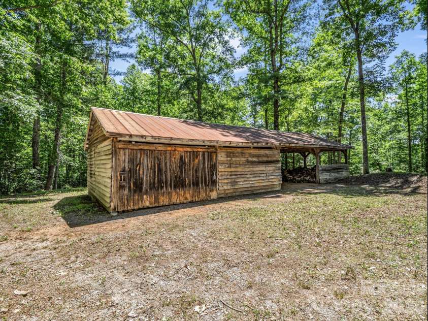 670 Cedar Creek Road, Lake Lure, NC 28746.  MLS# CAR4382823, YatesRealty ID 27969. Great barn/storage area!