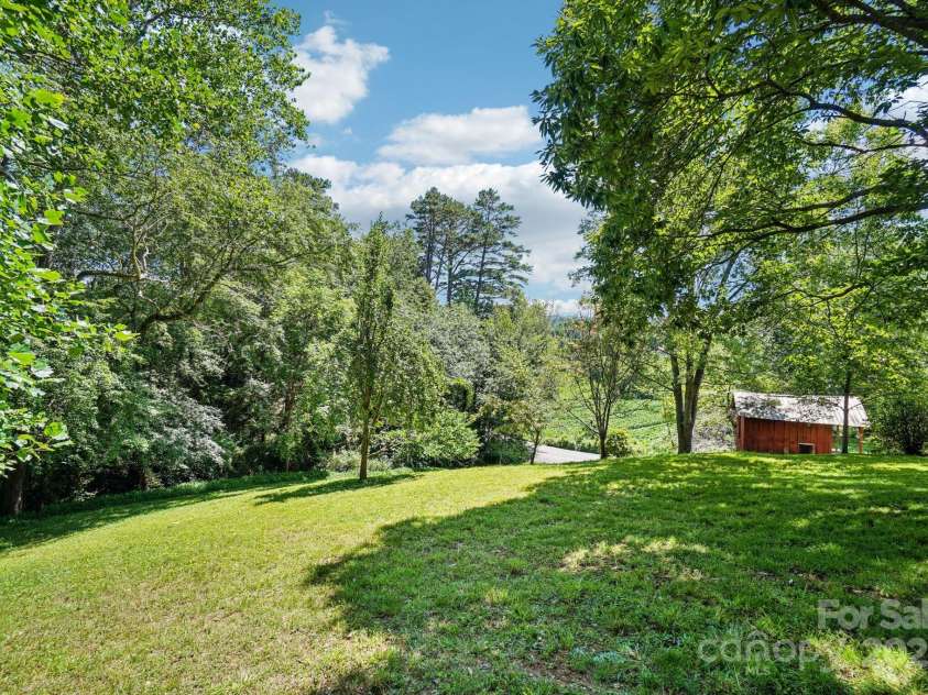 203 Beaverdam Road, Candler, NC 28715.  MLS# CAR4282589, YatesRealty ID 27973. Backyard 2