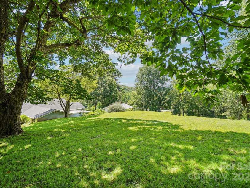 203 Beaverdam Road, Candler, NC 28715.  MLS# CAR4282589, YatesRealty ID 27973. Backyard