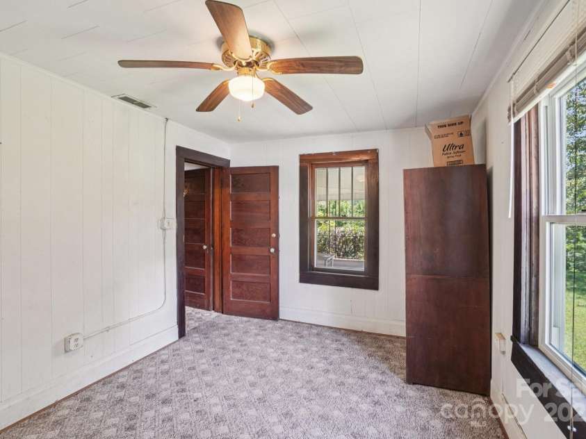 203 Beaverdam Road, Candler, NC 28715.  MLS# CAR4282589, YatesRealty ID 27973. Bedroom 1, toward door