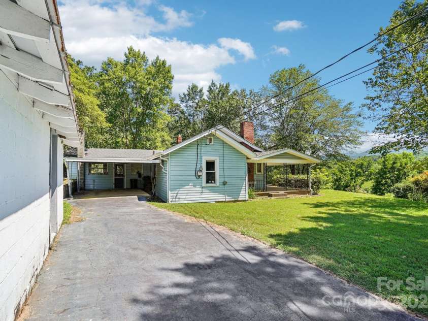 203 Beaverdam Road, Candler, NC 28715.  MLS# CAR4282589, YatesRealty ID 27973. Carport, approach from driveway