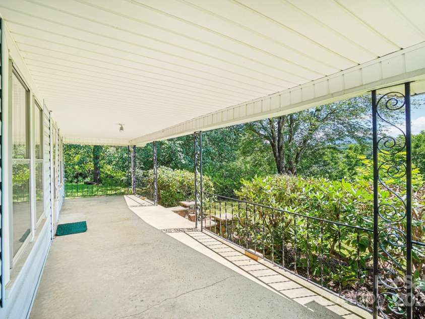 203 Beaverdam Road, Candler, NC 28715.  MLS# CAR4282589, YatesRealty ID 27973. Covered porch front
