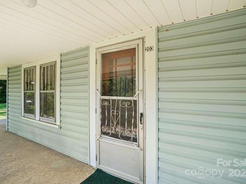 203 Beaverdam Road, Candler, NC 28715.  MLS# CAR4282589, YatesRealty ID 27973. Front door