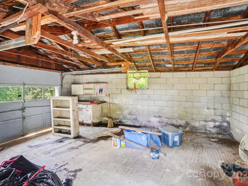 203 Beaverdam Road, Candler, NC 28715.  MLS# CAR4282589, YatesRealty ID 27973. Interior garage