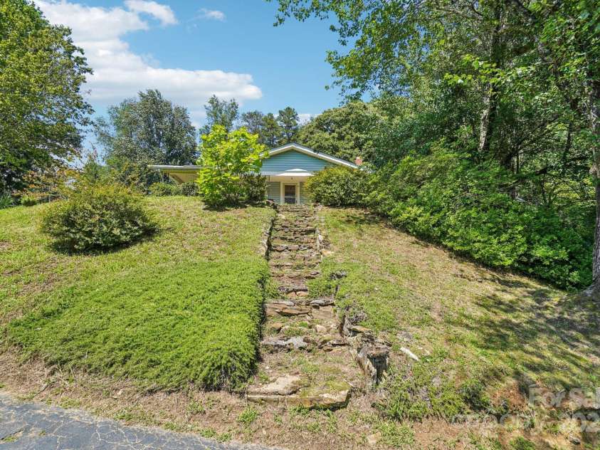 203 Beaverdam Road, Candler, NC 28715.  MLS# CAR4282589, YatesRealty ID 27973. Inviting stone step leading to front door