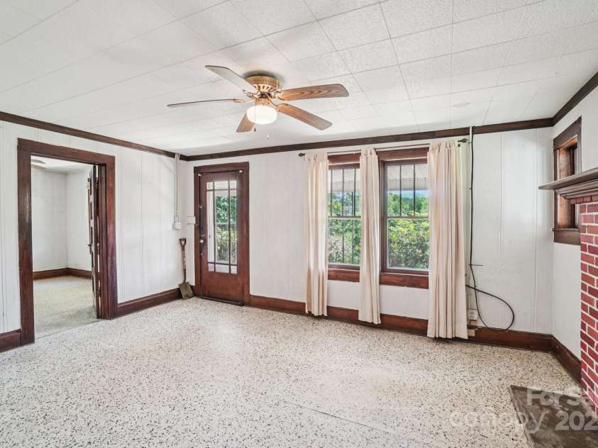 203 Beaverdam Road, Candler, NC 28715.  MLS# CAR4282589, YatesRealty ID 27973. Living room, toward bedroom