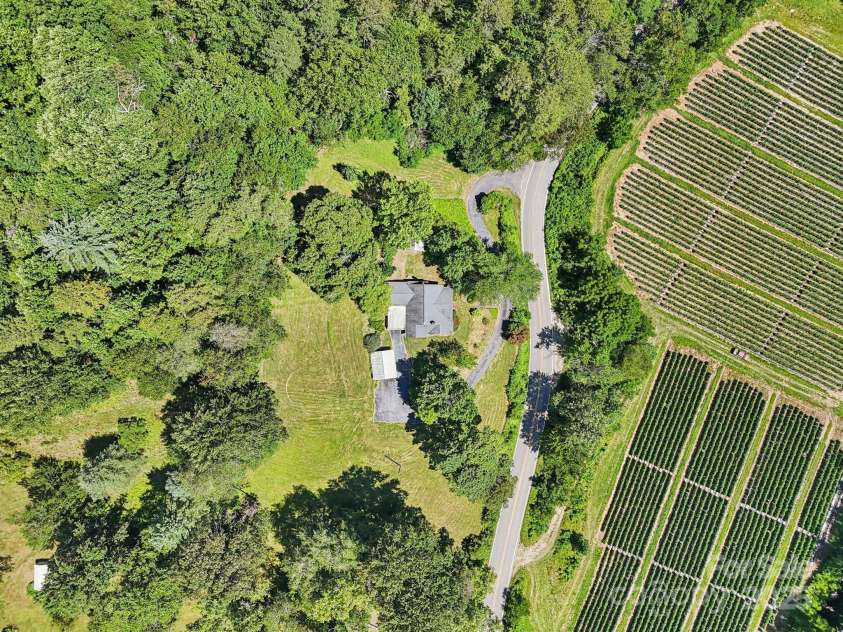 203 Beaverdam Road, Candler, NC 28715.  MLS# CAR4282589, YatesRealty ID 27973. Wide ariel view